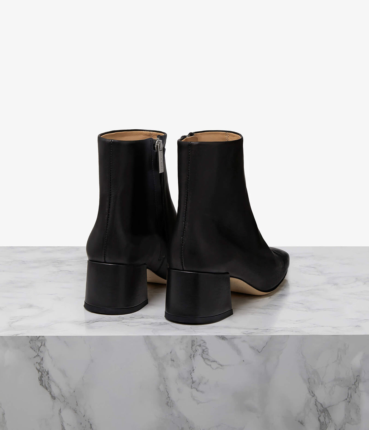 Designed to elevate the everyday, our Parade boot is crafted to a sleek, sculptural silhouette. Choose from a 50mm sculpted or block heel for the perfect amount of lift with ample arch support. Our perfectly placed zip runs all the way down to the arch for easy slip-on, regardless of foot type, while the superior leather options mould to your foot for the perfect fit. Let the modern square toe ground all your daytime looks.