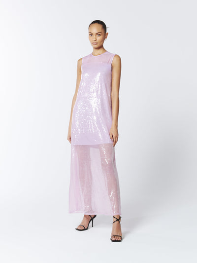 A vision of elegance, the SOUR FIGS Sequined Sheer Gown in Wisteria Purple boasts a sleeveless design, mesh fabric at the neckline, and dazzling sequined tulle for a show-stopping effect.