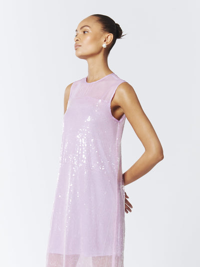 Turn heads in the SOUR FIGS Sequined Sheer Gown, a wisteria purple maxi dress with shimmering sequins, a sheer illusion neckline, and a dreamy silhouette.