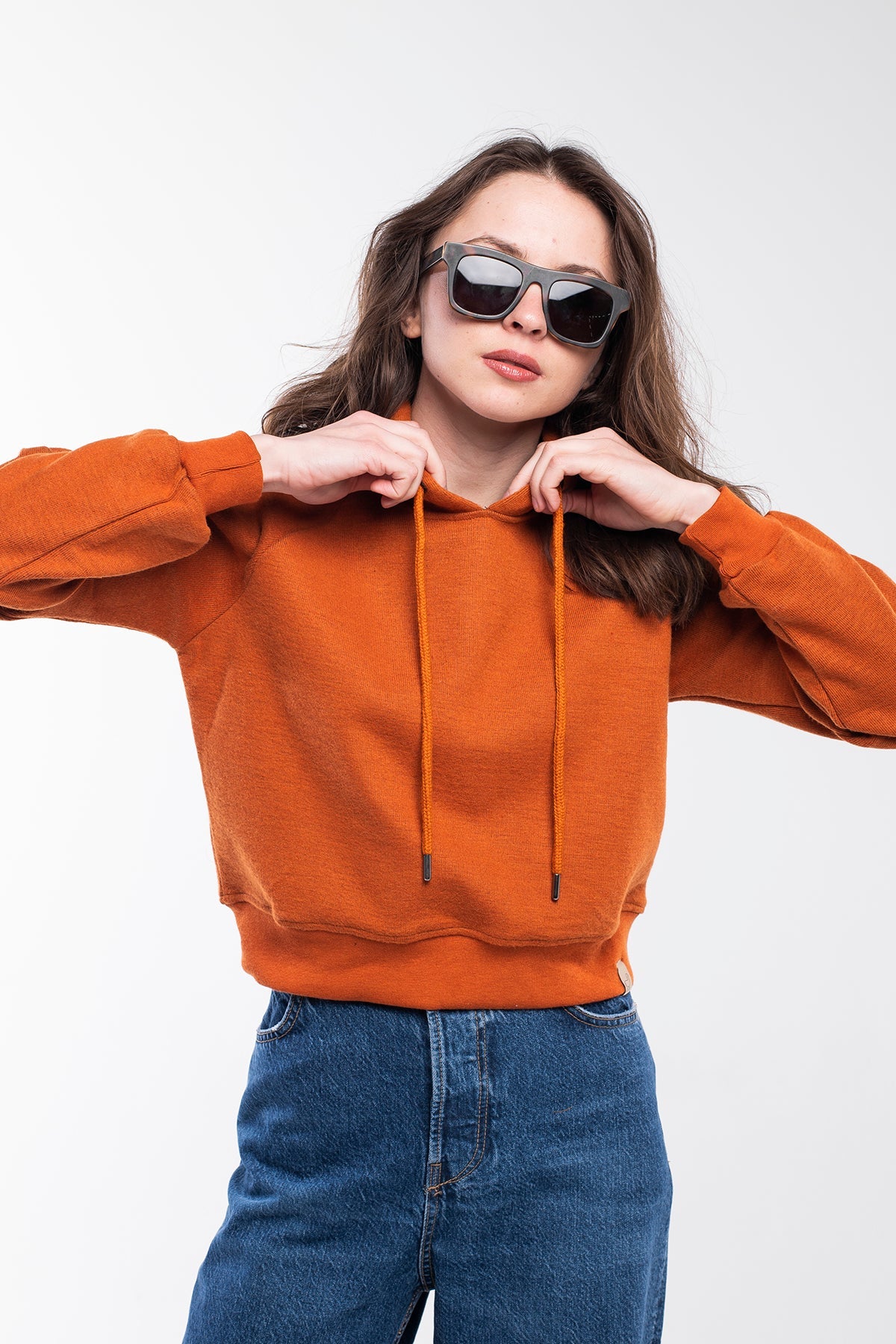 Cropped hoodie in tiger orange for women.