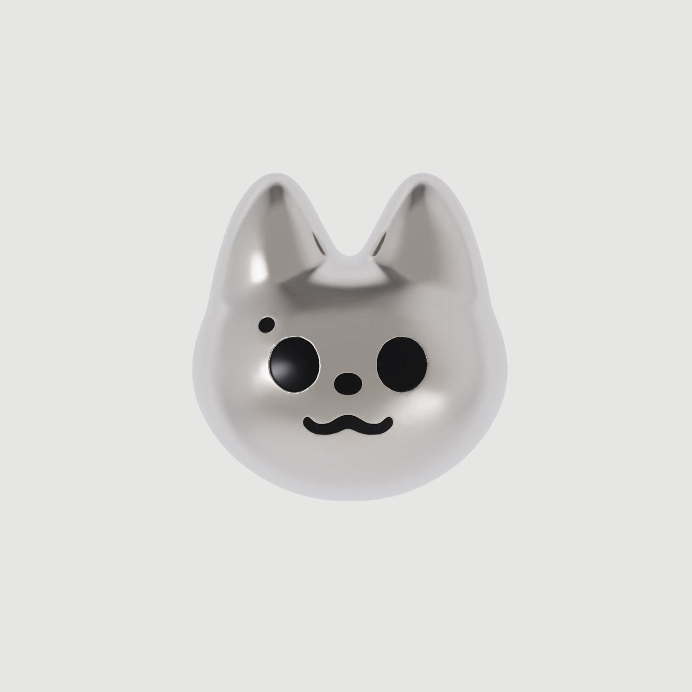 A single silver-colored cat-shaped earring with black eyes and a smile drawn on its face.