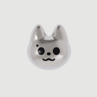 A single silver-colored cat-shaped earring with black eyes and a smile drawn on its face.