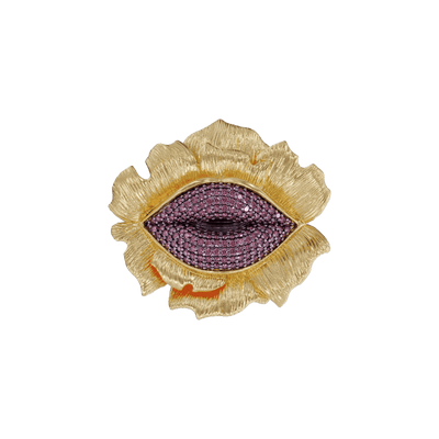 Gold and ruby lip-shaped jewelry piece on a gold flower