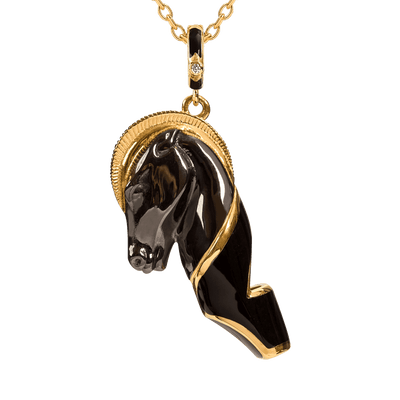 Black horse head pendant with gold accents on a chain against a dark blue background