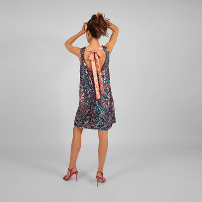 Nettie wearing Imu sequins shirt dress in pink and blue