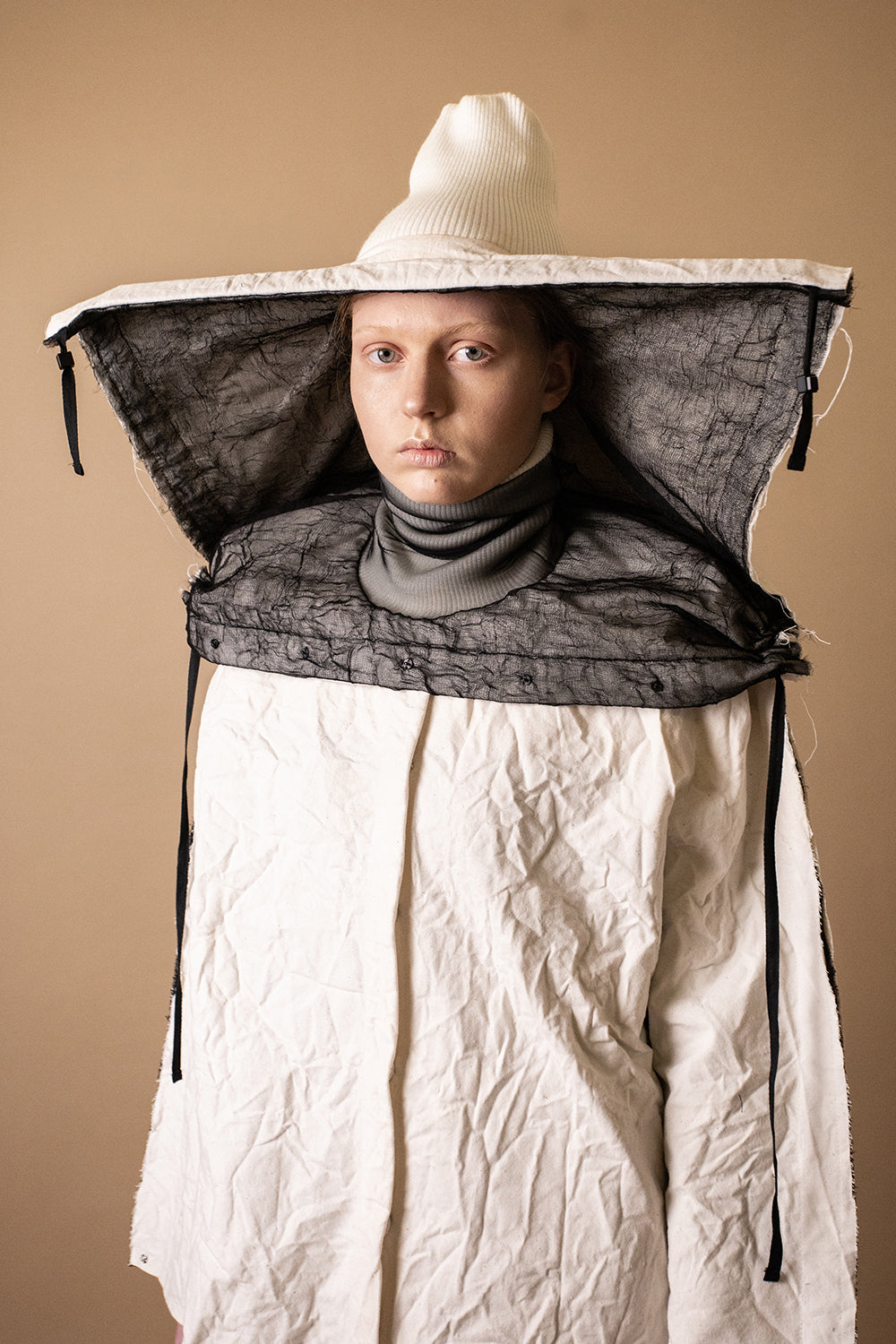 HYBRID 10-Way Transforming Piece: Coat / Hat / Bag - DZHUS - The Clothing Lounge