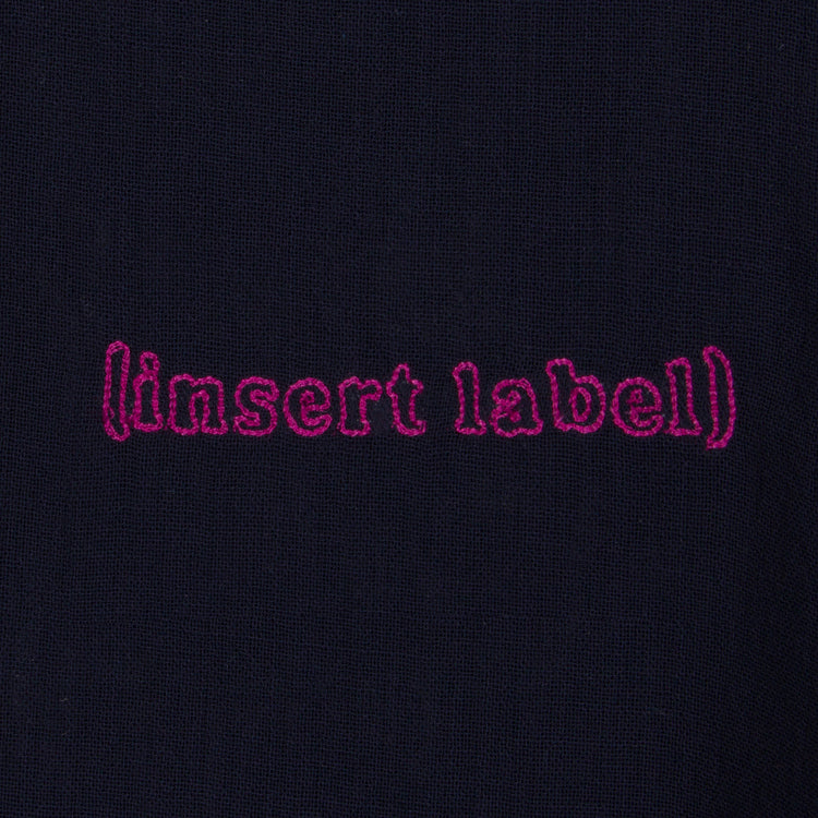 Detail image of embroidered (insert label)