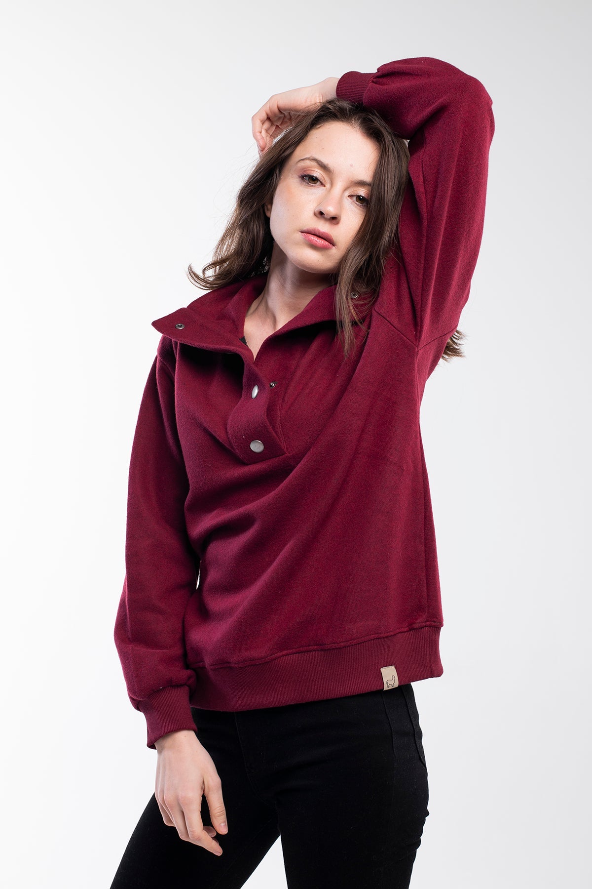 Sweater with a buttoned high neck in fuchsia purple for women.