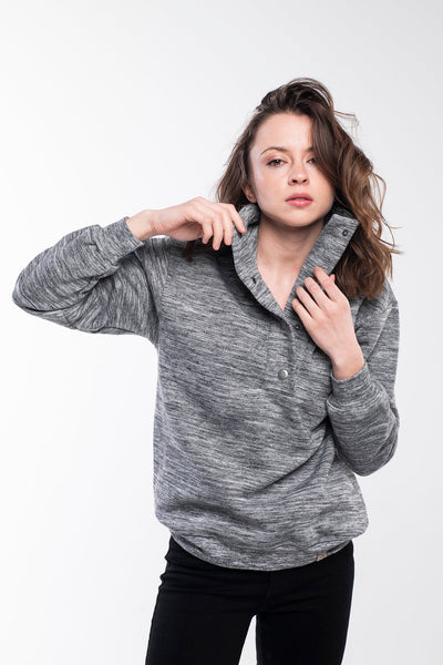 Sweater with a buttoned high neck in grey melange for women.
